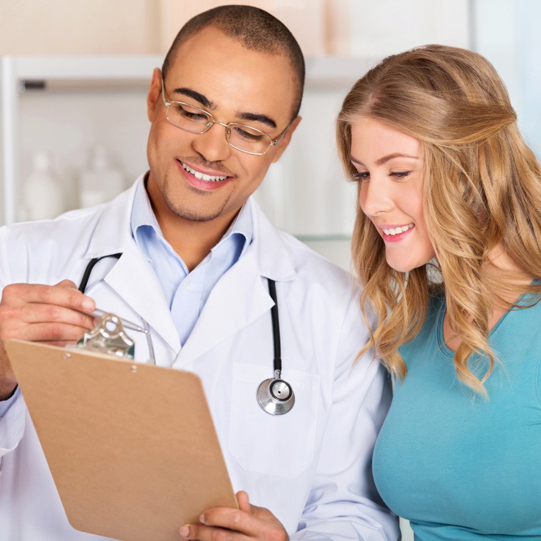 doctors aesthetics training where doctor is discussing report with patient