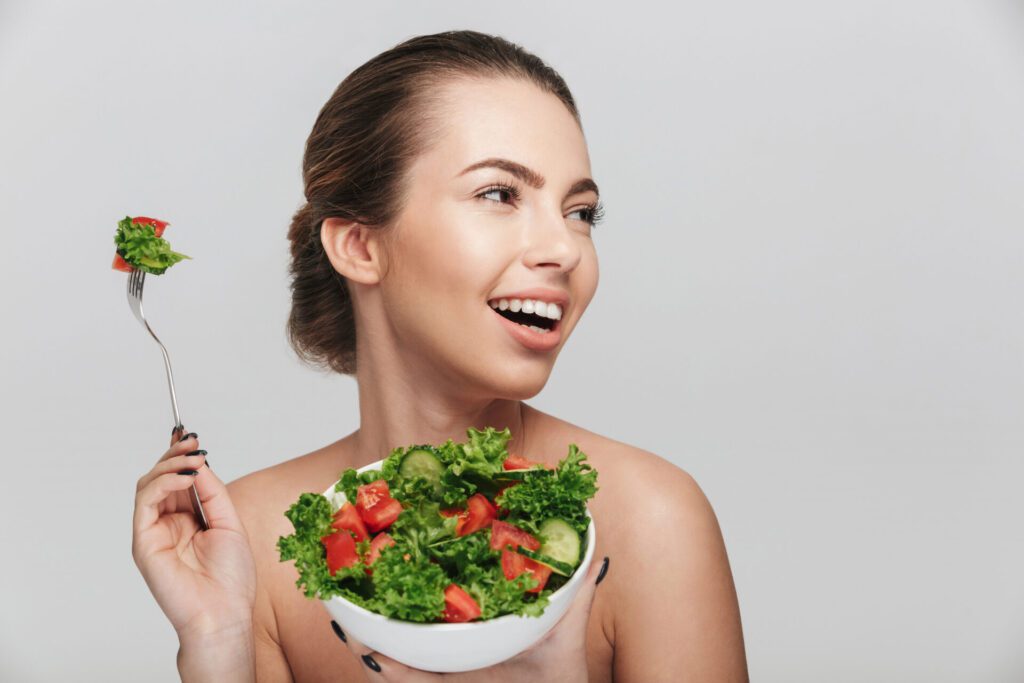 Women with Clear Skin with a bowl of healthy diet